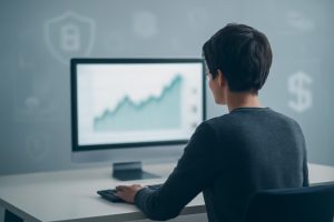 personne-bureau-ecran-graphique-financier